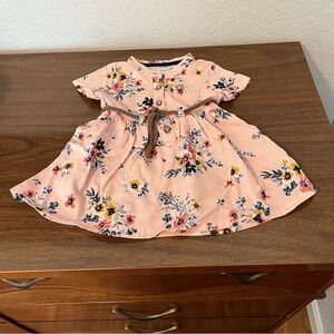 Carter's pink baby dress with a flowered print and soft, braided waist tie